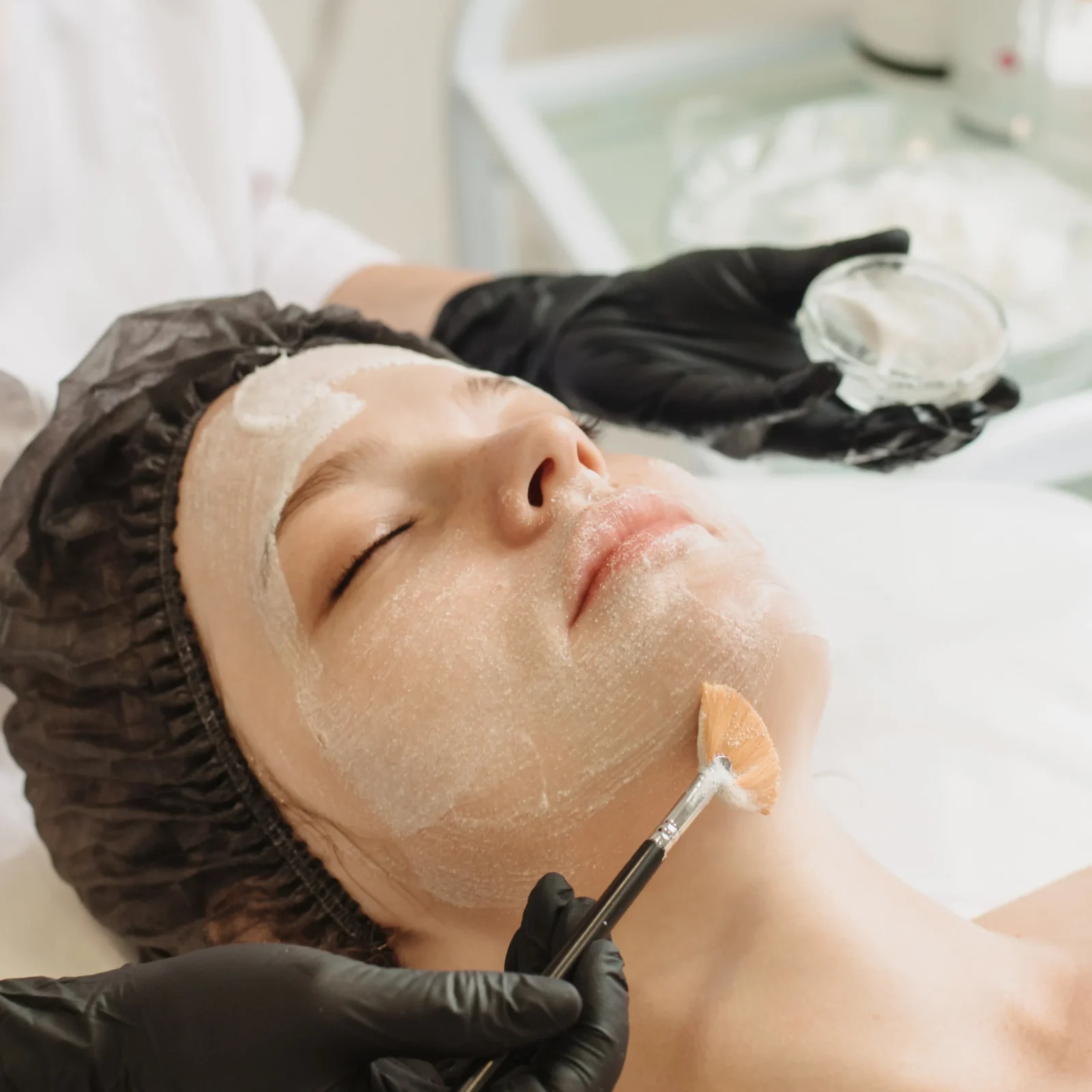 facial-peeling-spa-treatments-skin-care-woman-receiving-facial-care-from-cosmetologist-spa-closeup-vertical-photo (1)